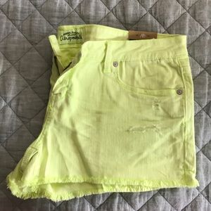 Neon yellow cut off shorts